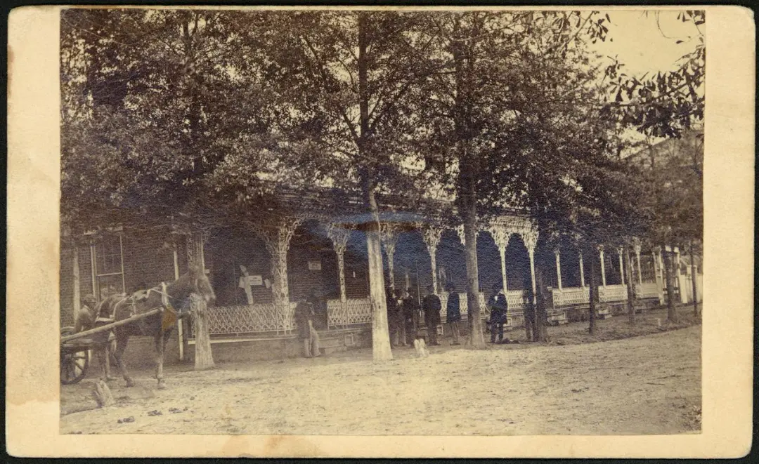 Sepia-toned photo of a building and trees