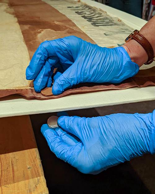 An example of the magnets placed on the front and back of the display.