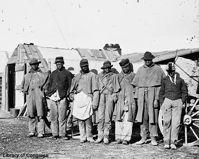 Photo of several formerly enslaved men working as teamsters for the US Army
